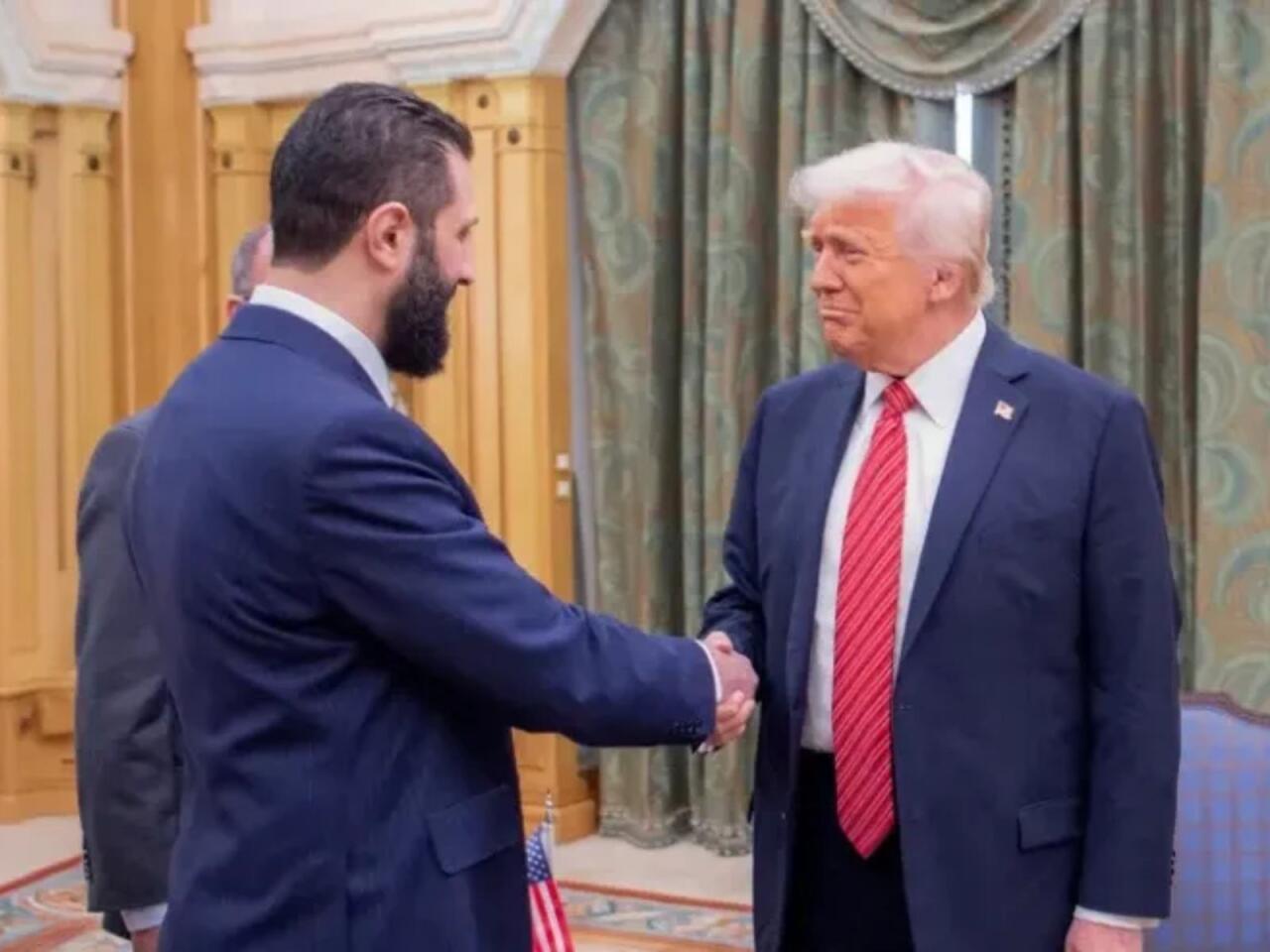 79 il sonra ilk  Şaraa Trampla görüşdü